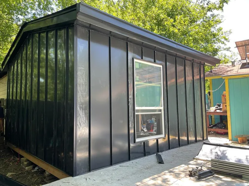 Black standing seam metal wall panels for Roof Inspection in Maplewood